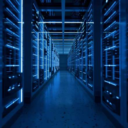 Engineer in data centre looking at lockable rack